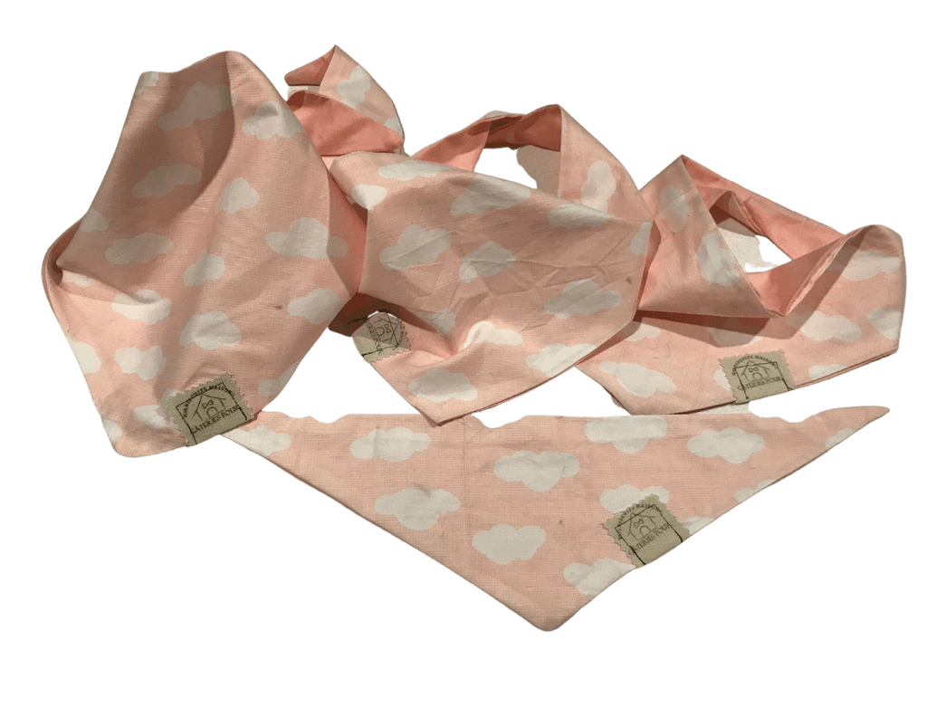 Soft pink dog bandanas with white cloud patterns, a serene accessory from Mes Biscuits Maison to match their hypoallergenic dog treats & supplements.