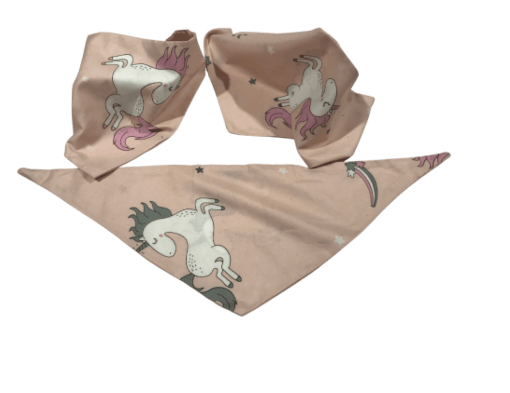 Pastel pink dog bandanas featuring whimsical unicorn patterns, offered by Mes Biscuits Maison along with hypoallergenic dog treats & supplements.