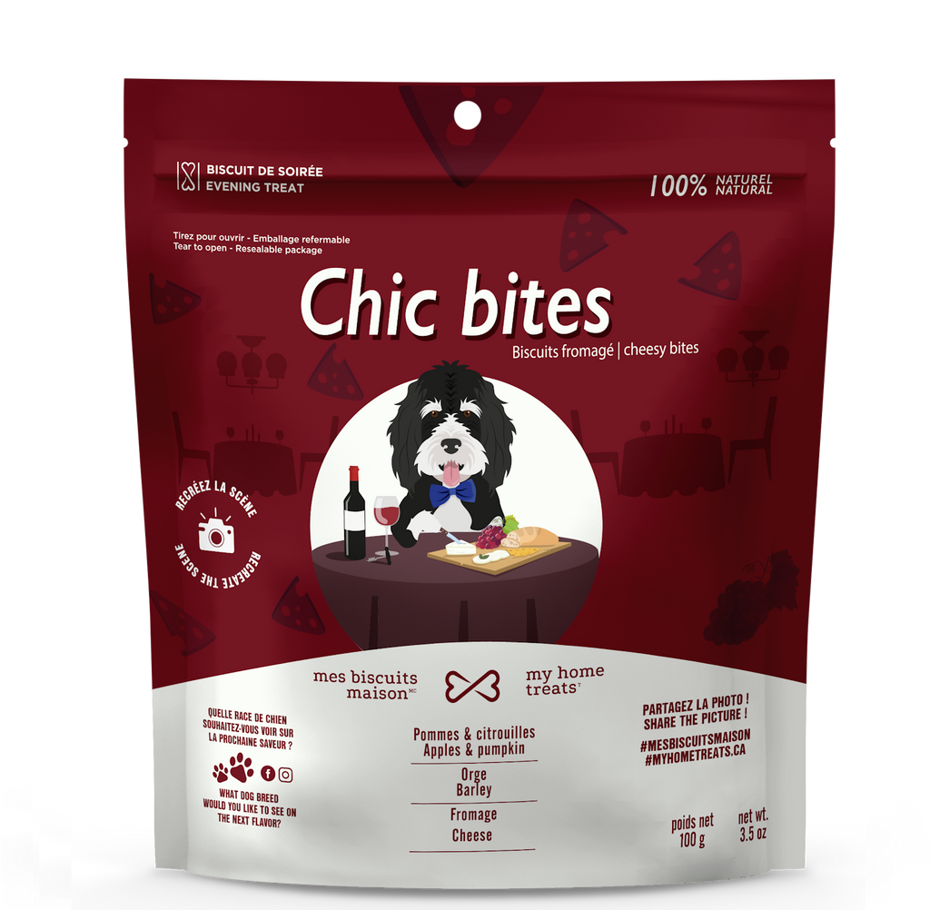 Front packaging of 'Chic Bites' dog treats, featuring a restaurant scene with a Bernedoodle. Includes parmesan cheese, apple puree and pumpkin puree and coconut oil for canine enjoyment.